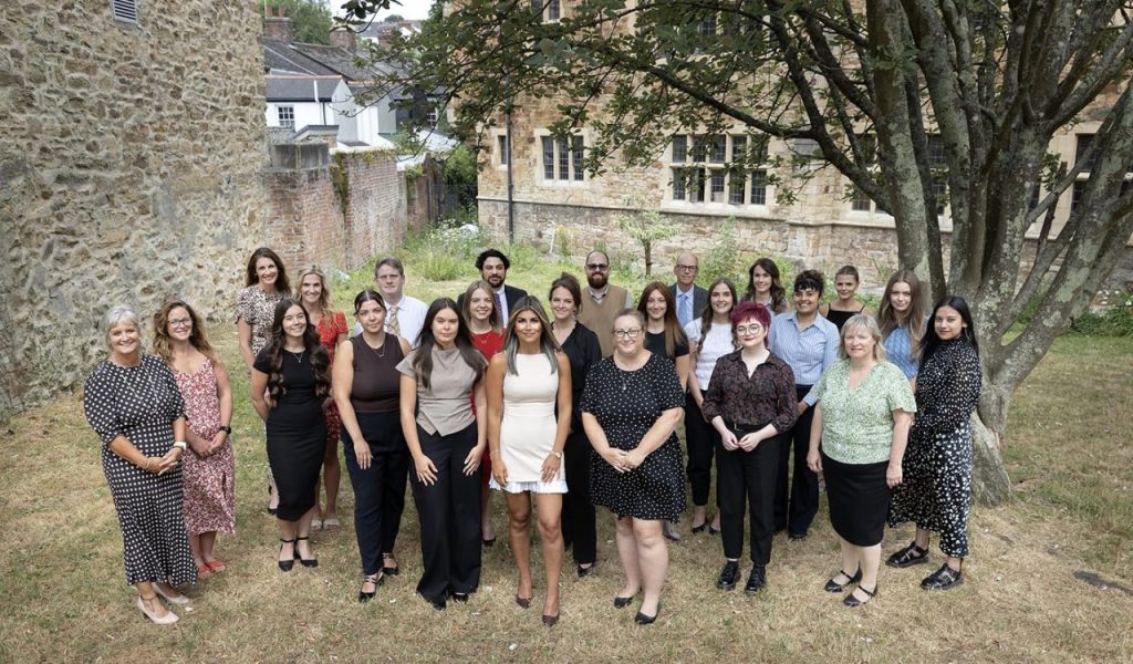 Picture of whole firm taken near the office in the grounds of Truro Cathedral